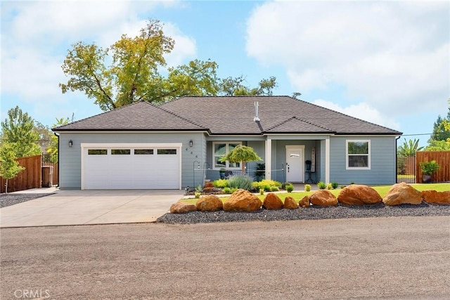 ranch-style home featuring concrete driveway, an attached garage, fence, and a porch