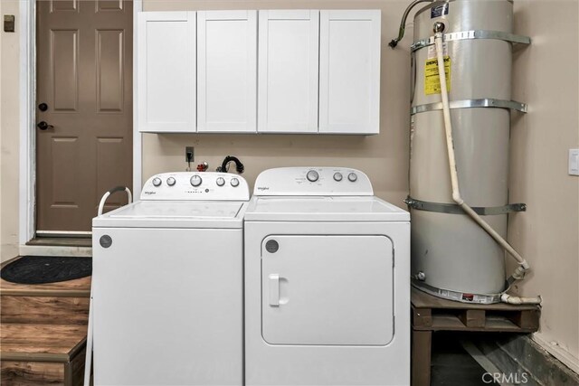 laundry room with cabinet space and washing machine and dryer