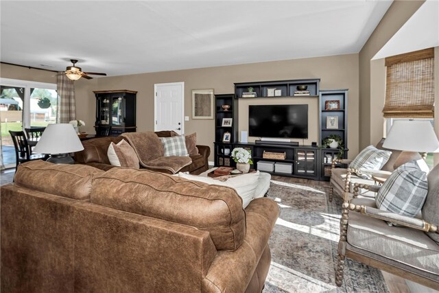 living room featuring ceiling fan and wood finished floors