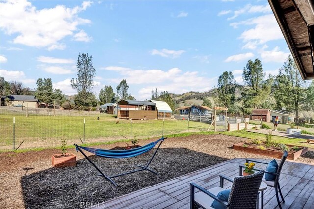 view of yard with a vegetable garden and fence