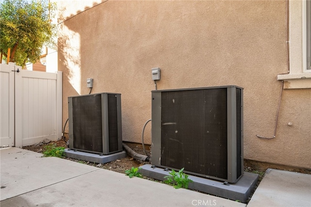 exterior space with fence and stucco siding