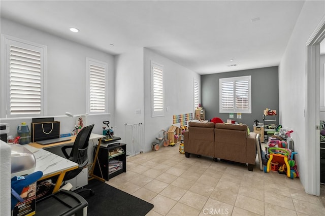 office space featuring light tile patterned flooring, recessed lighting, and visible vents