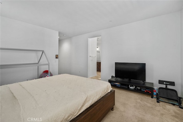 bedroom featuring light colored carpet