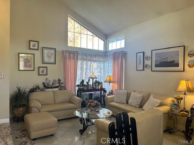 30103 Desert Rose Dr, Castaic, CA 91384 - living room with high vaulted ceiling and baseboards