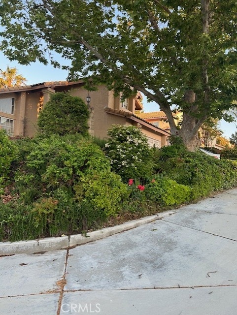 30103 Desert Rose Dr, Castaic, CA 91384 - view of home's exterior with stucco siding and a tile roof