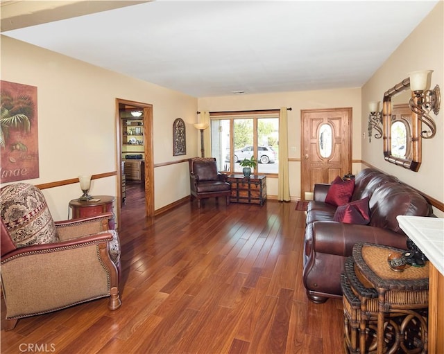 living room with baseboards and wood finished floors