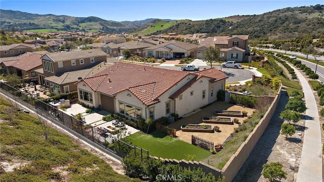 drone / aerial view featuring a mountain view and a residential view