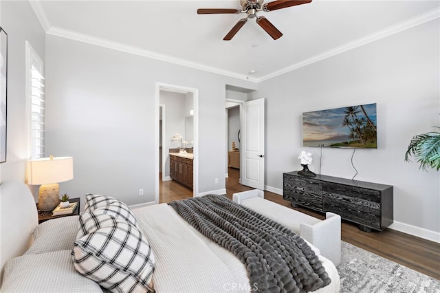 bedroom featuring ornamental molding, a ceiling fan, ensuite bath, wood finished floors, and baseboards