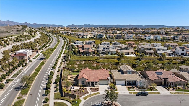 birds eye view of property featuring a mountain view and a residential view