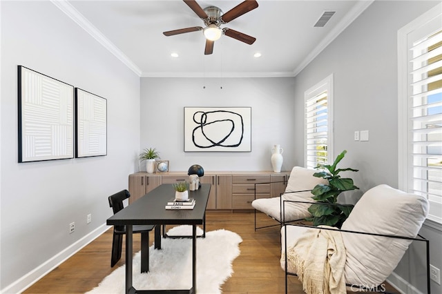 office with visible vents, baseboards, ornamental molding, recessed lighting, and wood finished floors