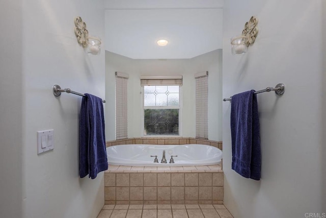 full bathroom with tile patterned flooring and a bath