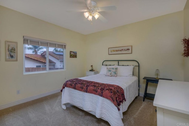 bedroom with baseboards, ceiling fan, and carpet flooring