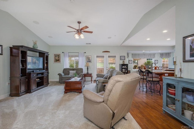 living area featuring recessed lighting, baseboards, lofted ceiling, and a ceiling fan