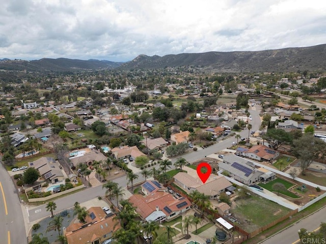 aerial view with a mountain view and a residential view