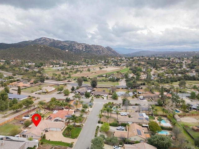 drone / aerial view featuring a mountain view and a residential view