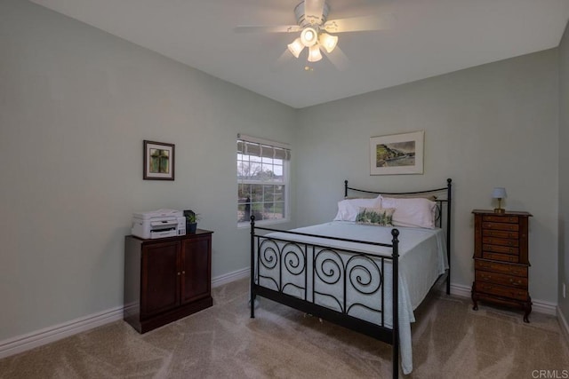 bedroom featuring carpet flooring, a ceiling fan, and baseboards