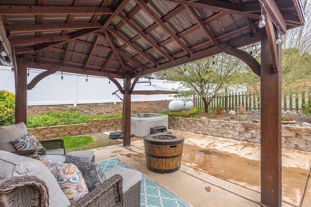 view of patio featuring outdoor lounge area, a gazebo, and fence