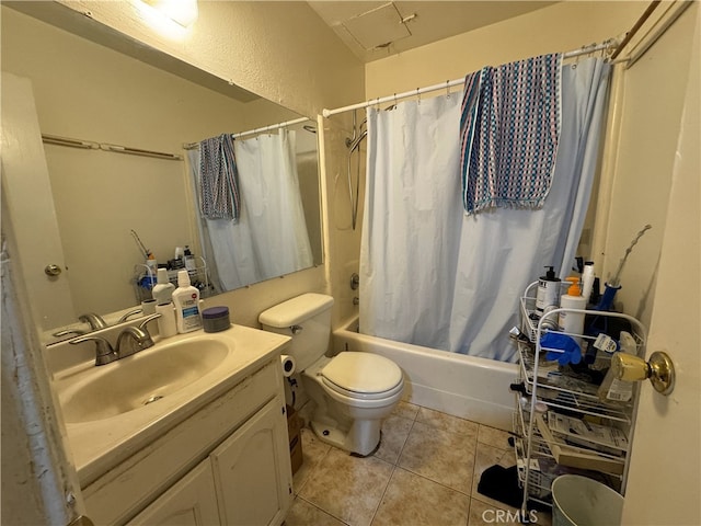 bathroom with toilet, shower / bath combo, vanity, and tile patterned flooring