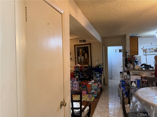 18620 Hatteras St Unit 166, Tarzana, CA 91356 - interior space featuring visible vents, a textured ceiling, and light tile patterned floors