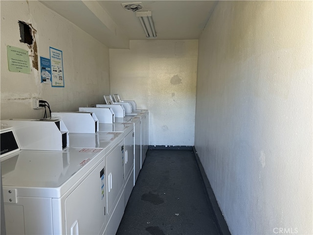 common laundry area with separate washer and dryer