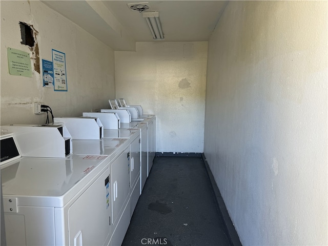 18620 Hatteras St Unit 166, Tarzana, CA 91356 - shared laundry area featuring separate washer and dryer, a textured wall, and baseboards