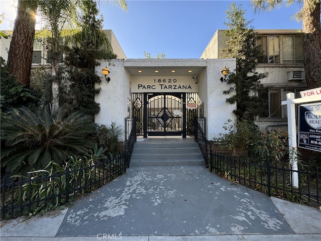 view of gate featuring fence