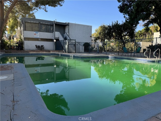 community pool with fence