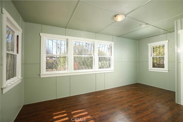 unfurnished room with wood finished floors