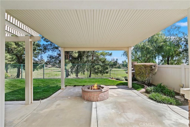 view of patio / terrace featuring a fenced backyard, a pergola, and an outdoor fire pit