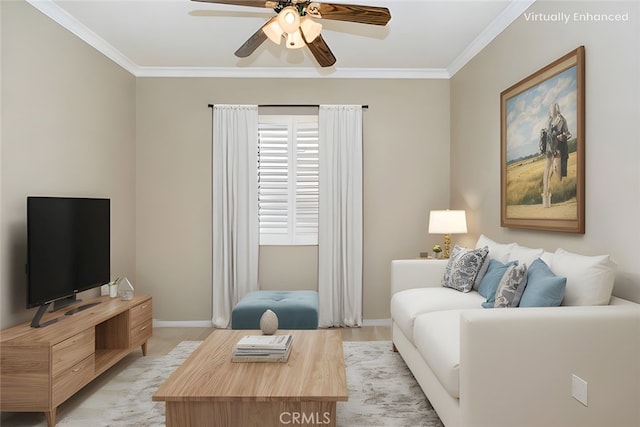 living room featuring crown molding, a ceiling fan, and baseboards