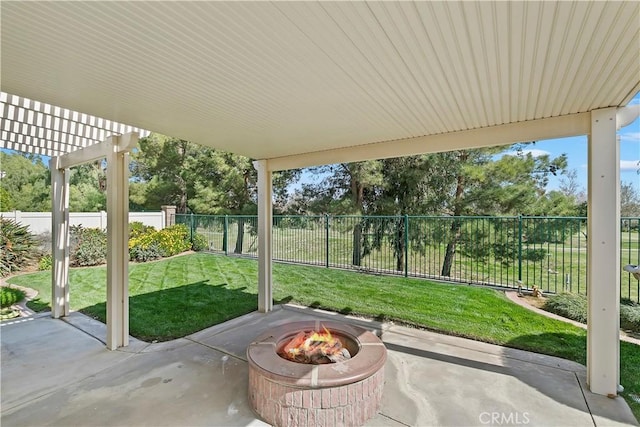 view of patio / terrace featuring a fenced backyard, a pergola, and an outdoor fire pit