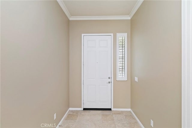 foyer with crown molding and baseboards