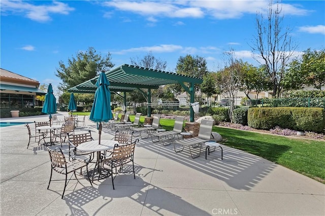 view of patio / terrace with a pergola and fence