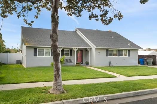 single story home with stucco siding, cooling unit, a front lawn, and fence