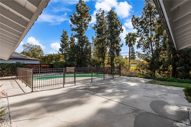 view of patio featuring a fenced in pool and fence