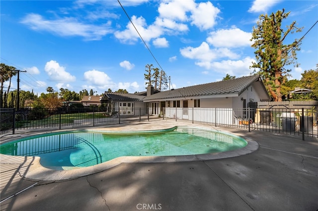 view of pool featuring a patio area, fence, and a fenced in pool