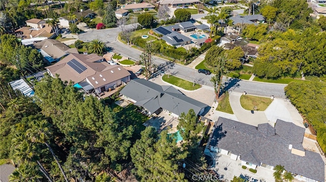 birds eye view of property with a residential view