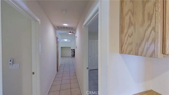 hallway with light tile patterned floors and visible vents