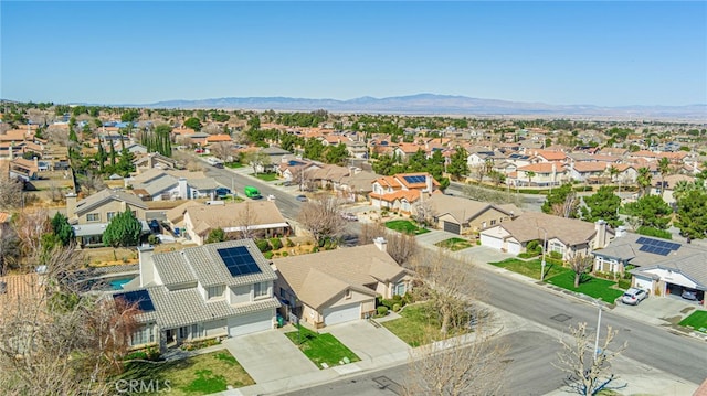 drone / aerial view featuring a mountain view and a residential view