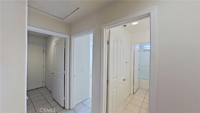 hallway featuring light tile patterned floors