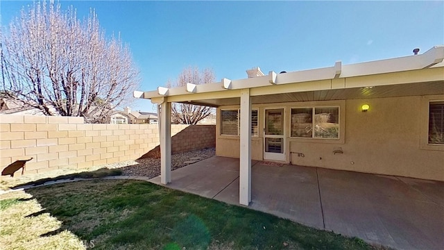 view of patio featuring fence