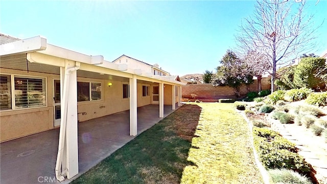 view of yard with a patio area and fence