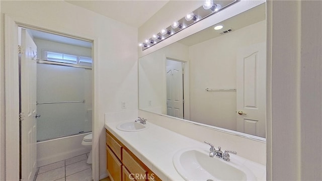 full bath featuring a sink, visible vents, toilet, and tile patterned floors