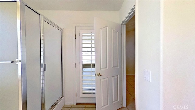 hallway with light tile patterned floors