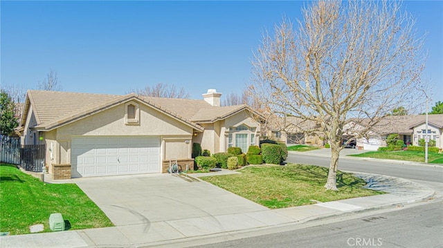 ranch-style house featuring concrete driveway, a front yard, stucco siding, a chimney, and a garage