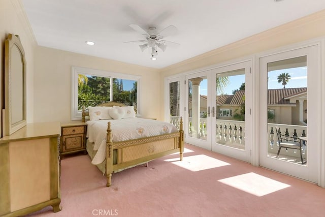 bedroom with a ceiling fan, access to exterior, light colored carpet, and ornamental molding