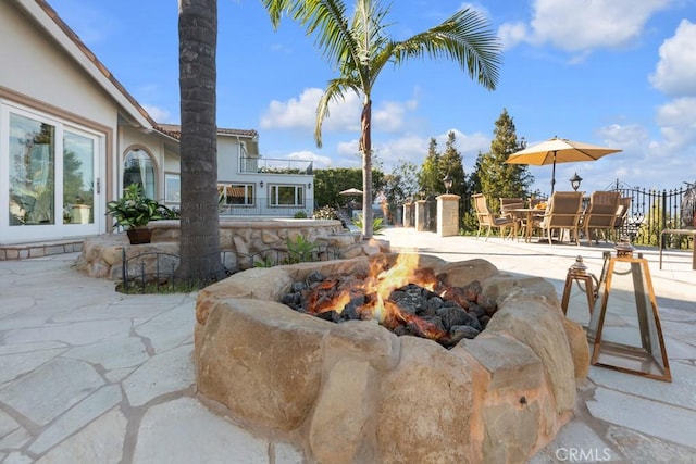 view of patio with a fire pit