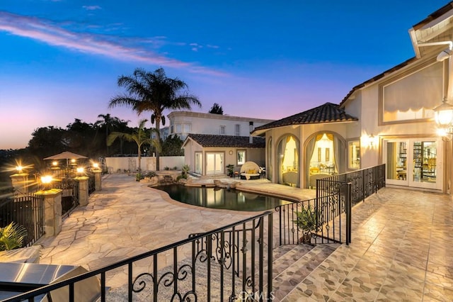 view of pool featuring a fenced in pool, french doors, a patio, and fence