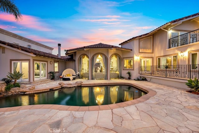 pool with a patio