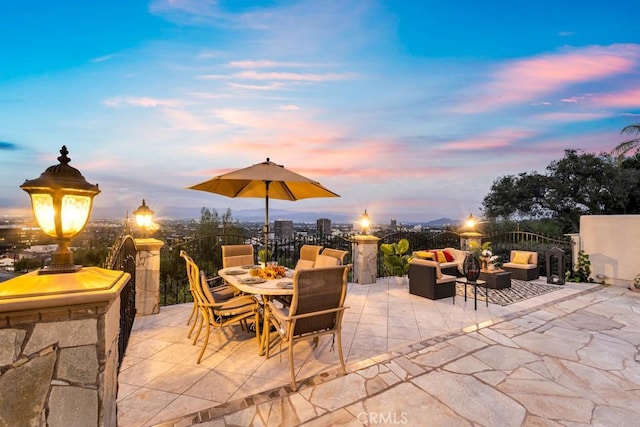 4440 Bergamo Dr, Encino, CA 91436 - patio terrace at dusk featuring an outdoor living space and outdoor dining area